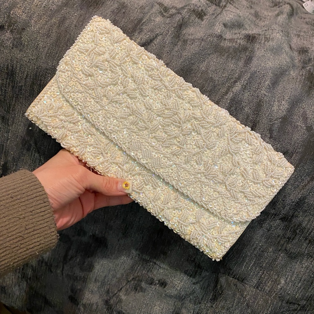Plush Beige Clutch with Flap Closure and Textured Finish